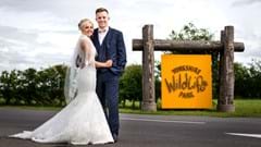 Bride and Groom next to YWP sign